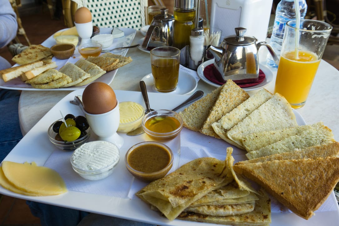 Breakfast in Tangier: msemen, eggs, honey, olives and tea