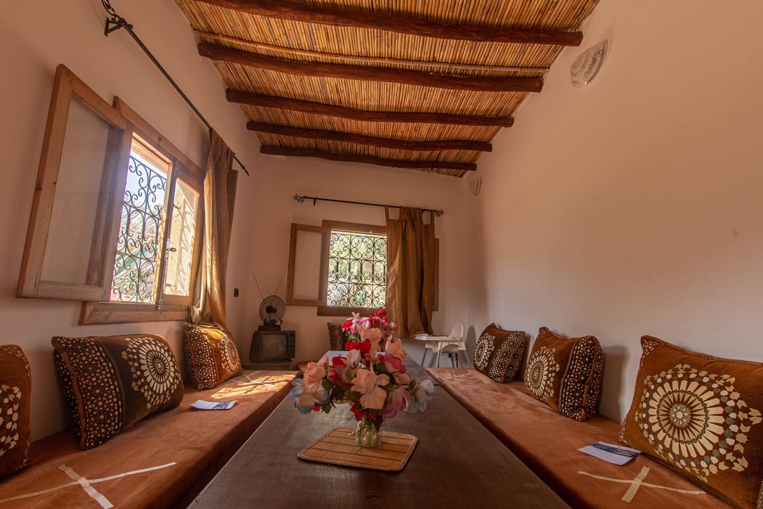 A traditional salon: benches along the walls, the low table